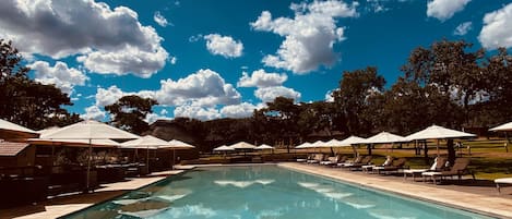 3 outdoor pools, open 7:30 AM to 8:30 PM, pool umbrellas, pool loungers