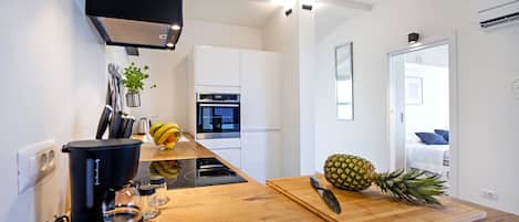 Apartment, Sea View | Living area | Flat-screen TV