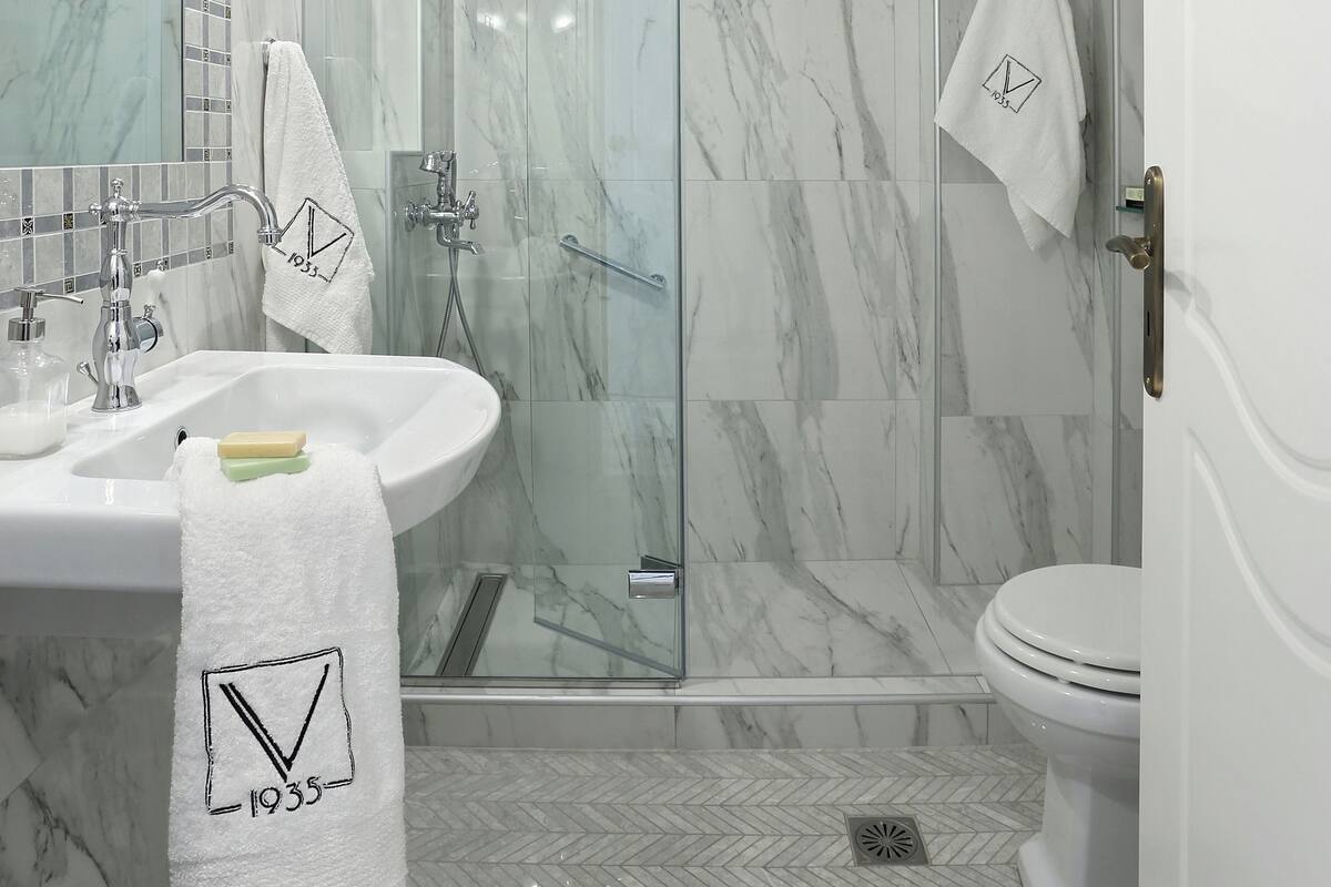 Shower, free toiletries, hair dryer, slippers