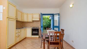 Departamento, 2 habitaciones (Giardino) | Cocina privada | Refrigerador con congelador, horno, parrilla de estufa y periquera