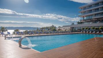 3 indoor pools, outdoor pool, open 9:00 AM to 7:00 PM, pool umbrellas
