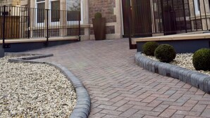 A two-story house with a brick facade, large windows, and a gated entrance. - Rowan Tree Your Apartment (Bristol)