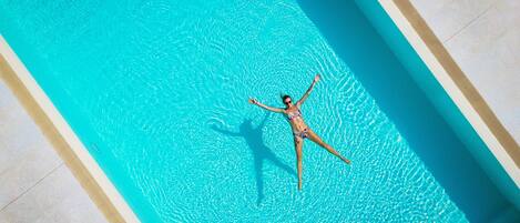 Seasonal outdoor pool, open 8:00 AM to 7:00 PM, pool umbrellas
