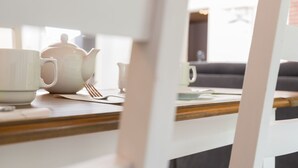 A dining table with a teapot, cups, and cutlery. - Eifelnatur (Haus 2) by Interhome (Immerath)