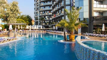Seasonal outdoor pool, open 8:00 AM to 7:00 PM, pool umbrellas