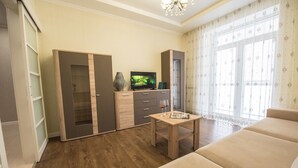 Departamento, 1 habitación | Área de sala de estar | Televisión de pantalla plana 