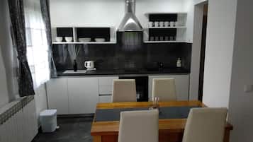 Family Apartment, Multiple Beds, Garden View | Private kitchen | Electric kettle