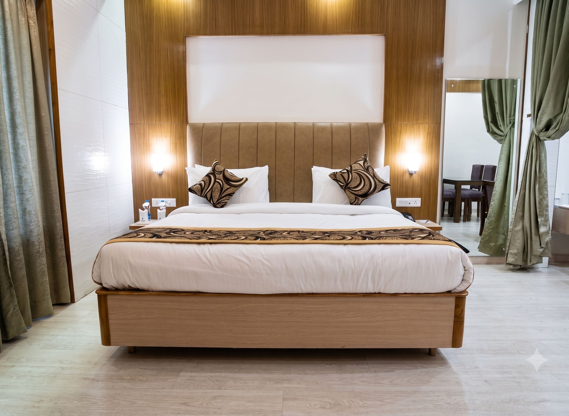 A large bed with a wooden frame, two bedside tables, and a headboard with integrated lighting.