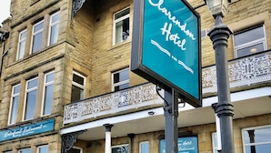 A historic building with a sign for 'Clarendon Hotel'. - The Clarendon Hotel (Morecambe)