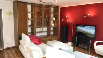 Comfort Condo, 1 King Bed with Sofa bed, Garden View | Living room | Flat-screen TV