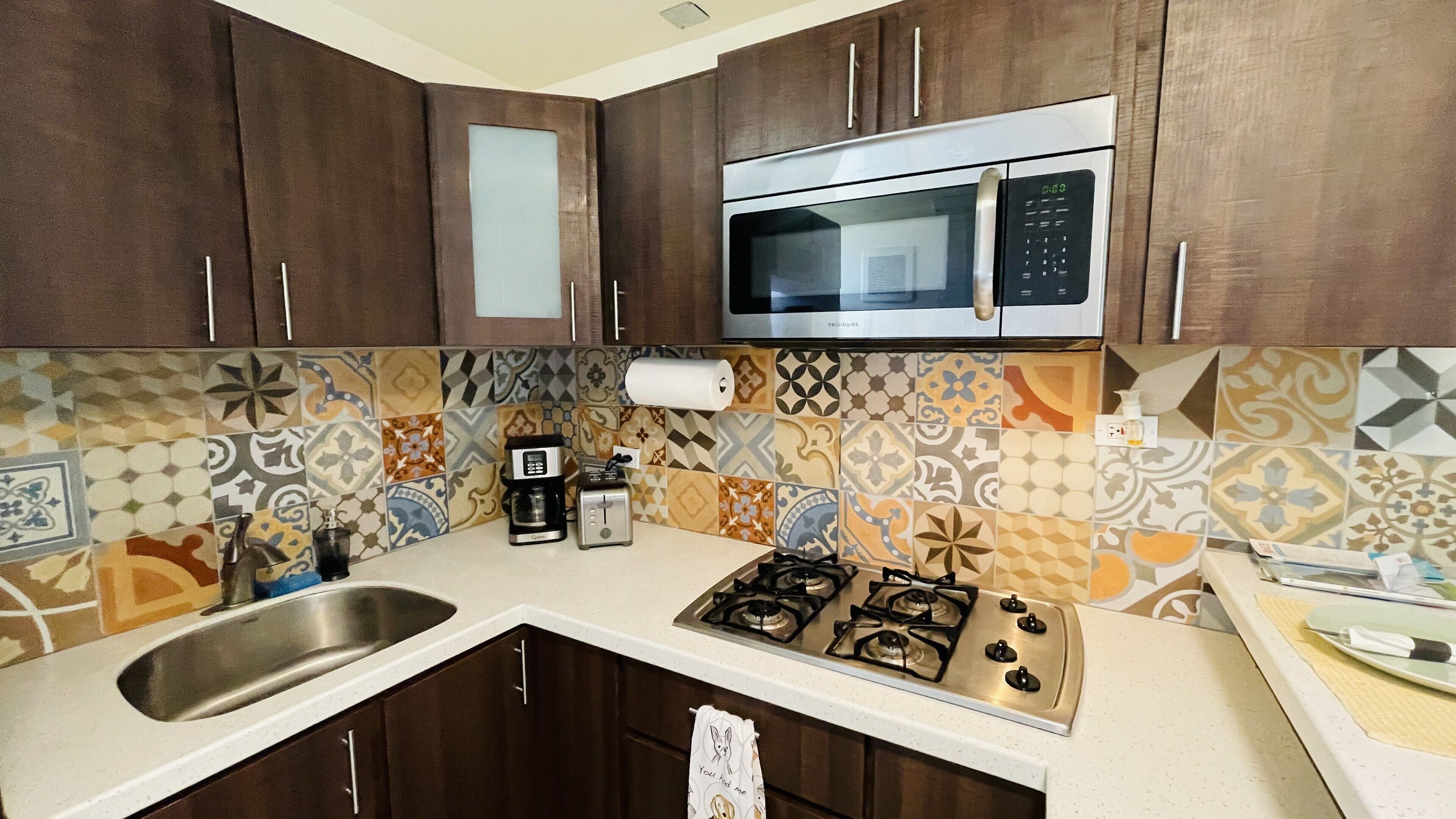 Fridge, microwave, stovetop, coffee/tea maker