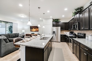 Condo, 5 Bedrooms | Private kitchen | Fridge, microwave, oven, stovetop - Windsor at Westside - 8915 Geneve By Fairytale VR (Kissimmee)