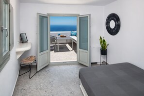 Lava Suite, two bedroom suite with sea view and hot tub | Living area | 42-inch Smart TV with satellite channels, TV - Seven Suites (Santorini)