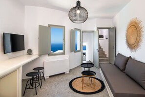 Lava Suite, two bedroom suite with sea view and hot tub | Living area | 42-inch Smart TV with satellite channels, TV - Seven Suites (Santorini)