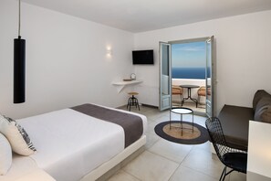 Ammos Suite , Junior Suite 1 with sea view | Living area | 42-inch Smart TV with satellite channels, TV - Seven Suites (Santorini)