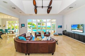 TV, books, stereo, offices - Faroway Luxury Ocean & Beach Villa - South Sound 4BR Oceanfront Estate (South Sound)