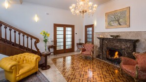 A grand foyer with a chandelier, a fireplace, and a staircase. - Villa Diocletian (Split)