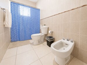 A bathroom with a toilet, bidet, and a trash bin. - Colinas del Atlantico for 18 People (Isabela)