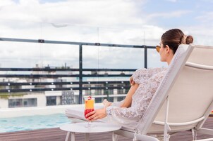 Outdoor pool, open 8:00 AM to 7:00 PM, pool umbrellas, sun loungers