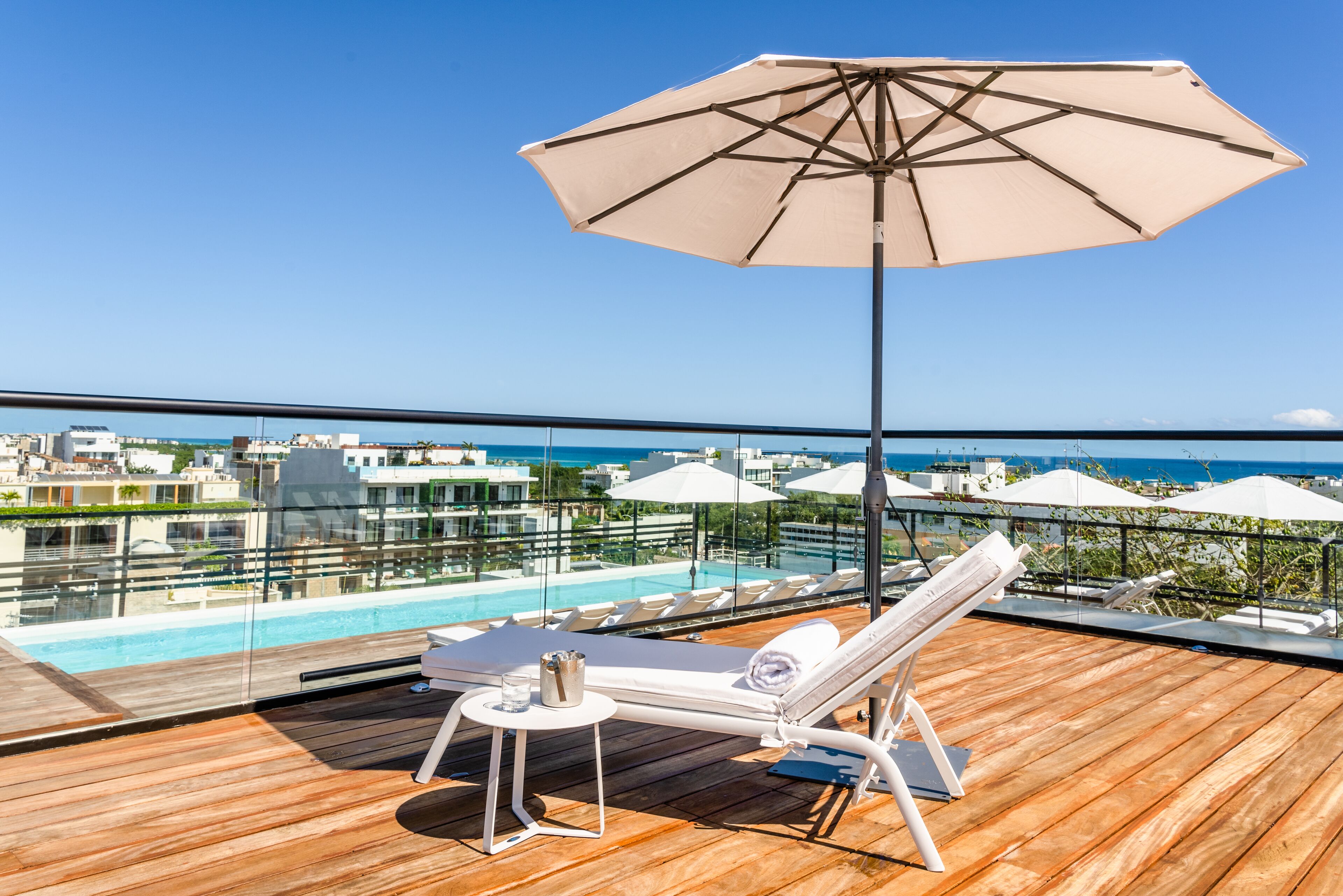 outdoor pool, open 8:00 am to 7:00 pm, pool umbrellas, pool loungers