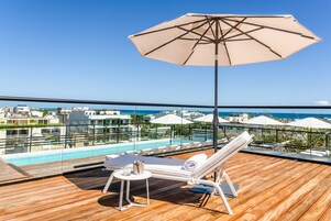 Outdoor pool, open 8:00 AM to 7:00 PM, pool umbrellas, sun loungers