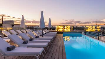 Outdoor pool, open 8:00 AM to 7:00 PM, pool umbrellas, pool loungers