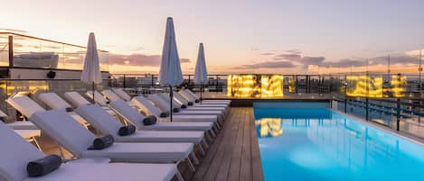 Outdoor pool, open 8:00 AM to 7:00 PM, pool umbrellas, pool loungers