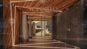 A modern hotel boutique with a wooden interior and a glass facade. - Serenity Hotel Boutique by Alsol (Playa del Carmen)