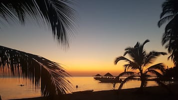On the beach, sun loungers, beach towels