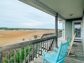 A wooden deck with a view of a large body of water and distant land. - A Beach To Remember 4 Bedroom Home by RedAwning (Supply)