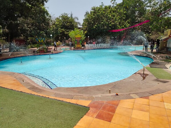 Outdoor pool, open 9:00 AM to 6:00 PM, pool umbrellas, pool loungers