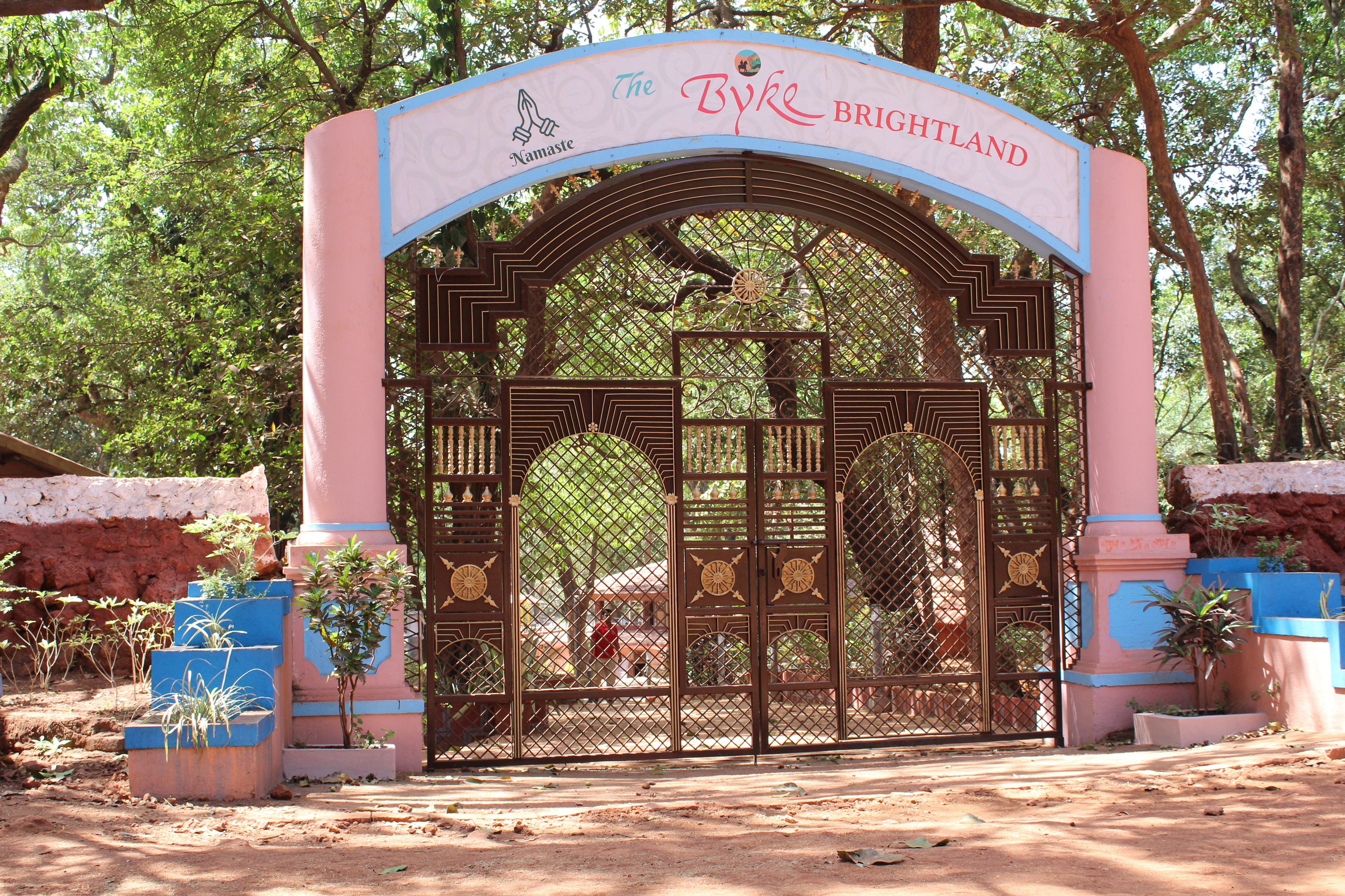 A gated entrance with a sign reading "The Byke Brightland."
