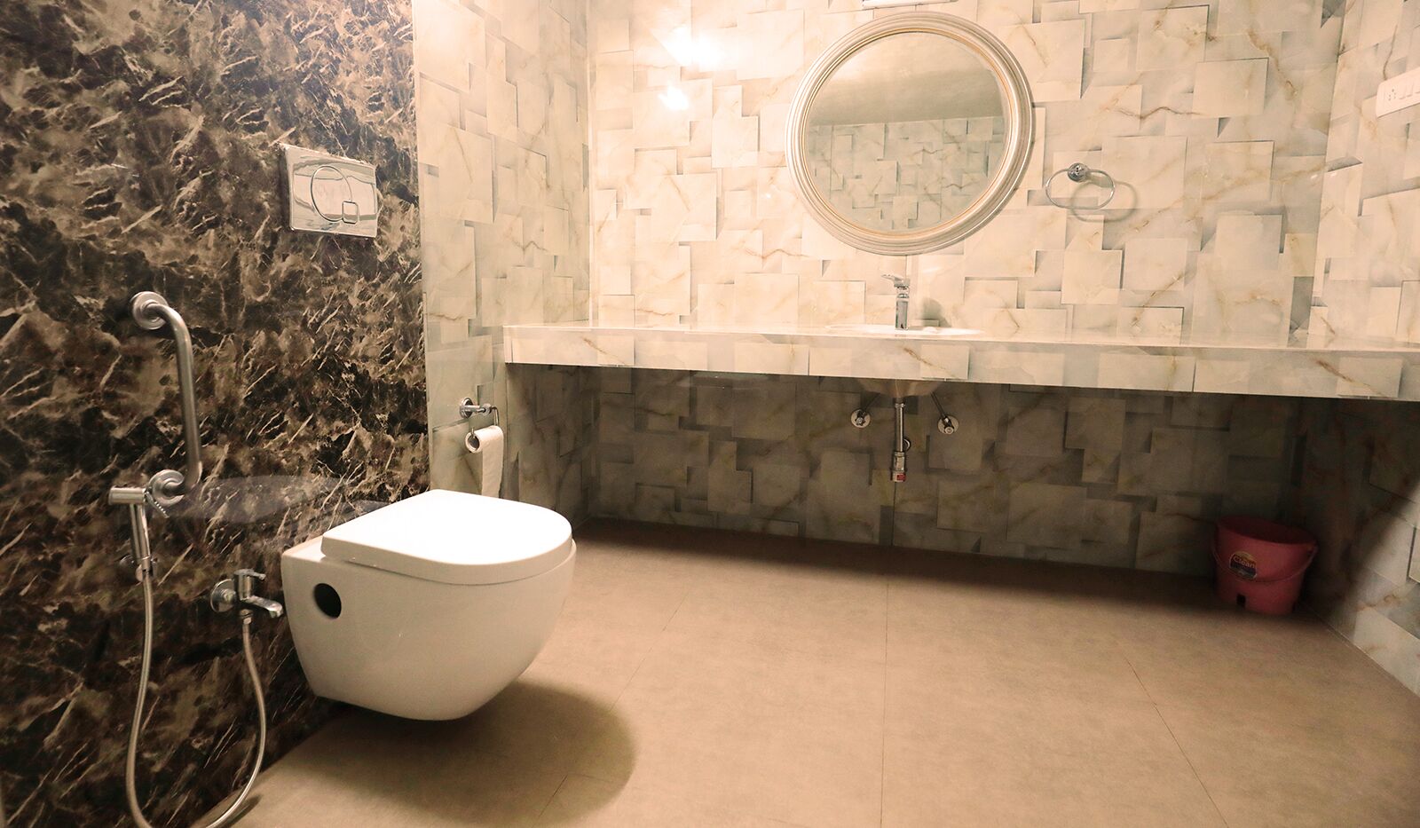 A bathroom with a toilet, a sink, and a shower.