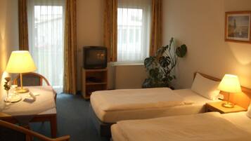 Desk, laptop workspace, blackout drapes, soundproofing