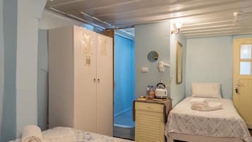 Economy Quadruple Room | Premium bedding, iron/ironing board (on request), WiFi (free)