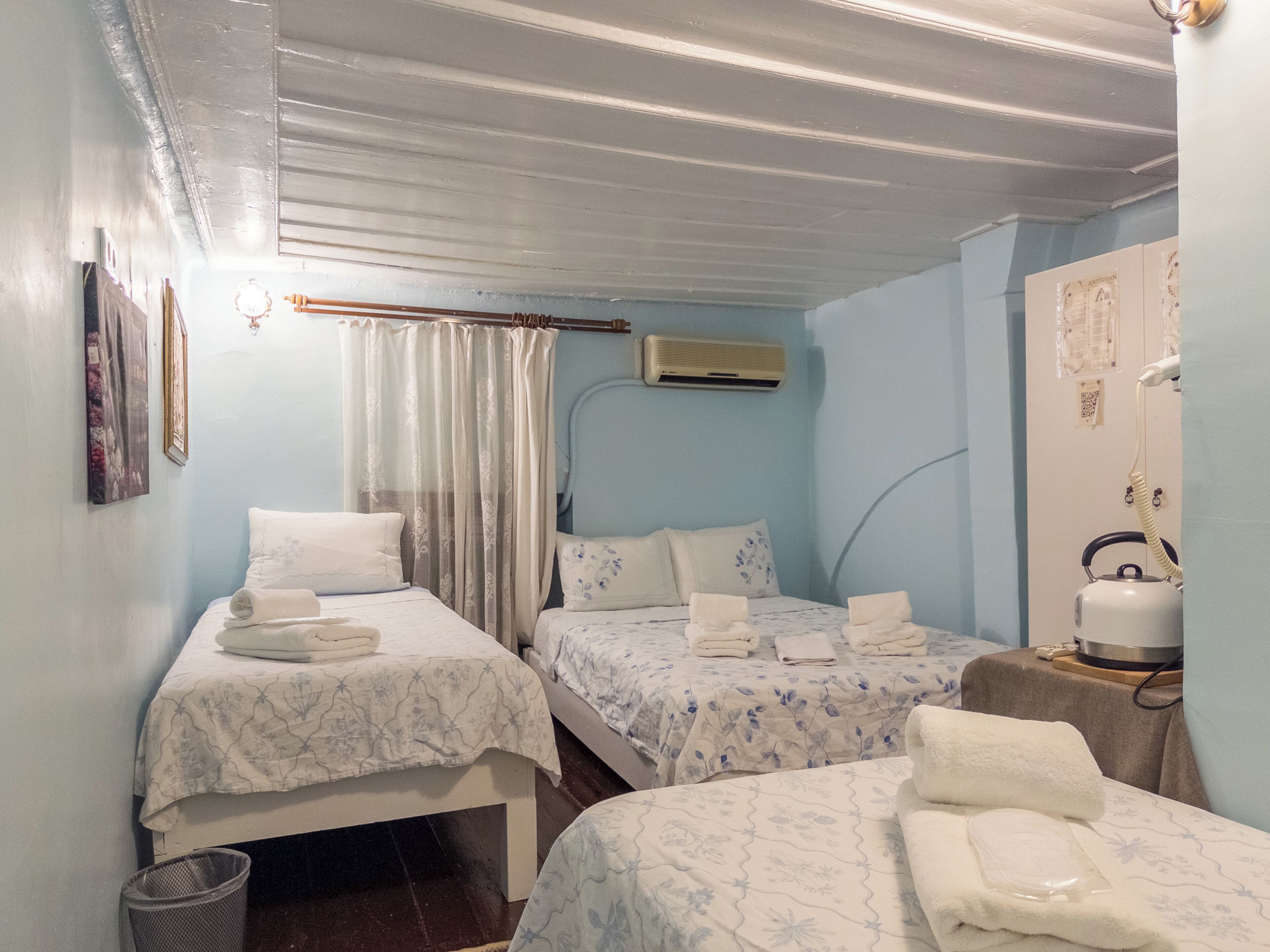 Economy Quadruple Room | Premium bedding, iron/ironing board, free WiFi, bed sheets