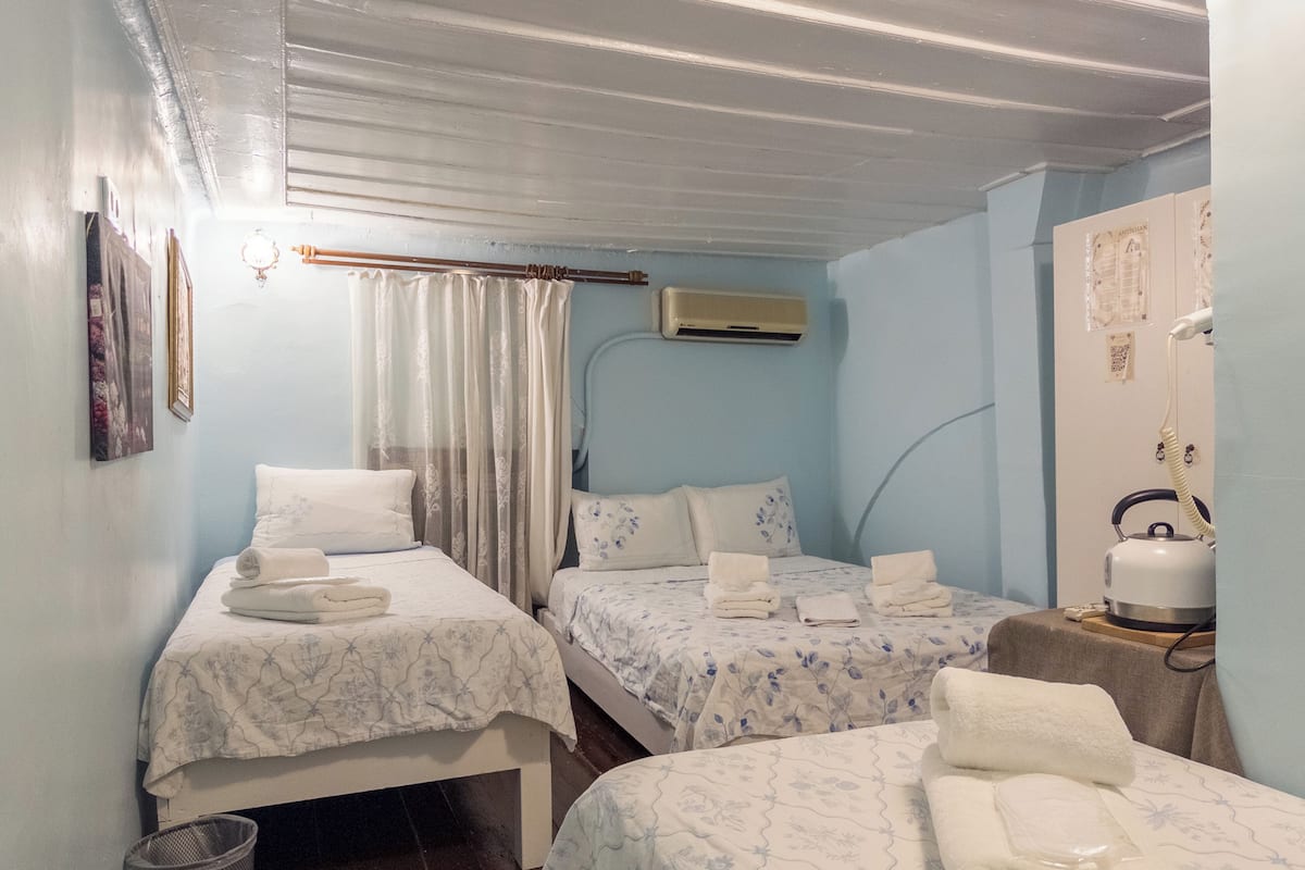 Economy Quadruple Room | Premium bedding, iron/ironing board (on request), WiFi (free)