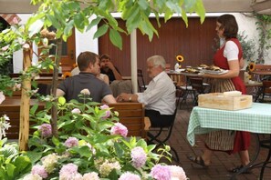 Breakfast, lunch, dinner served; local cuisine, alfresco dining