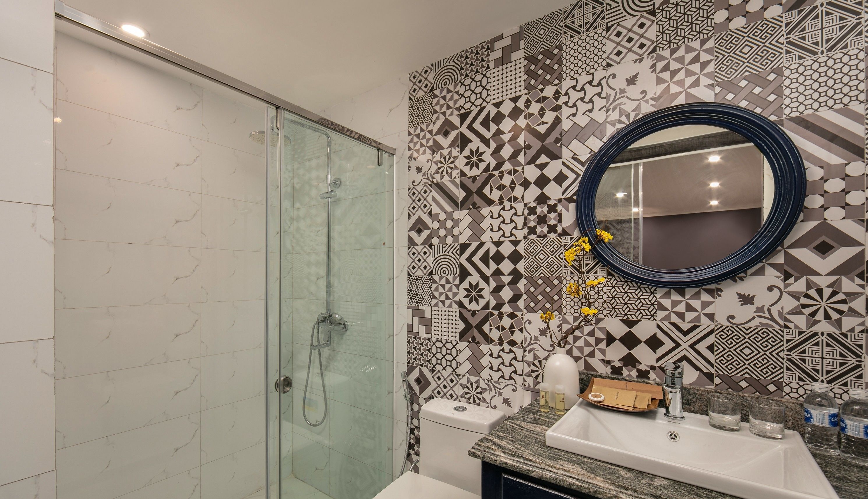 executive twin | bathroom | rainfall showerhead, designer toiletries, hair dryer, slippers