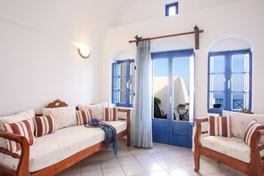 Panoramic Apartment | Living area | Flat-screen TV, printers - Pergeri Apartments (Santorini)