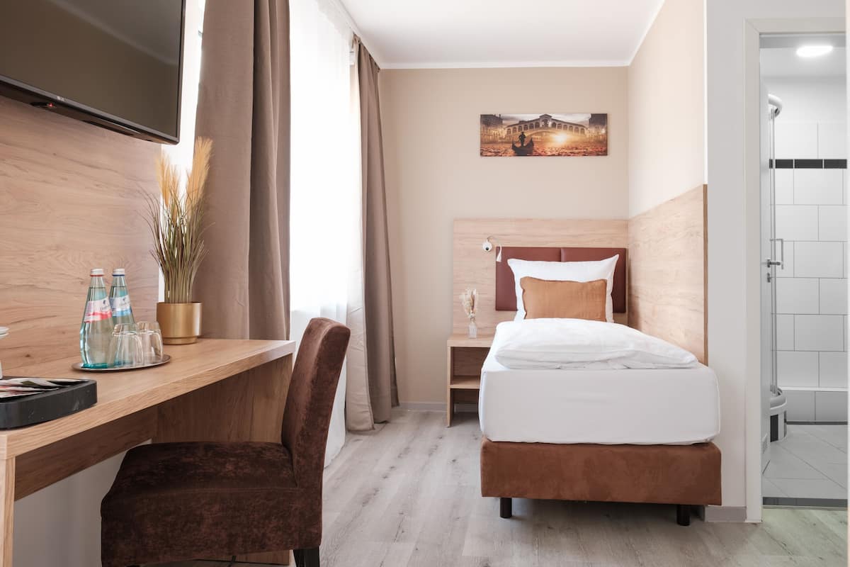 Habitació individual Deluxe | Escriptori, cortines opaques i habitacions insonoritzades