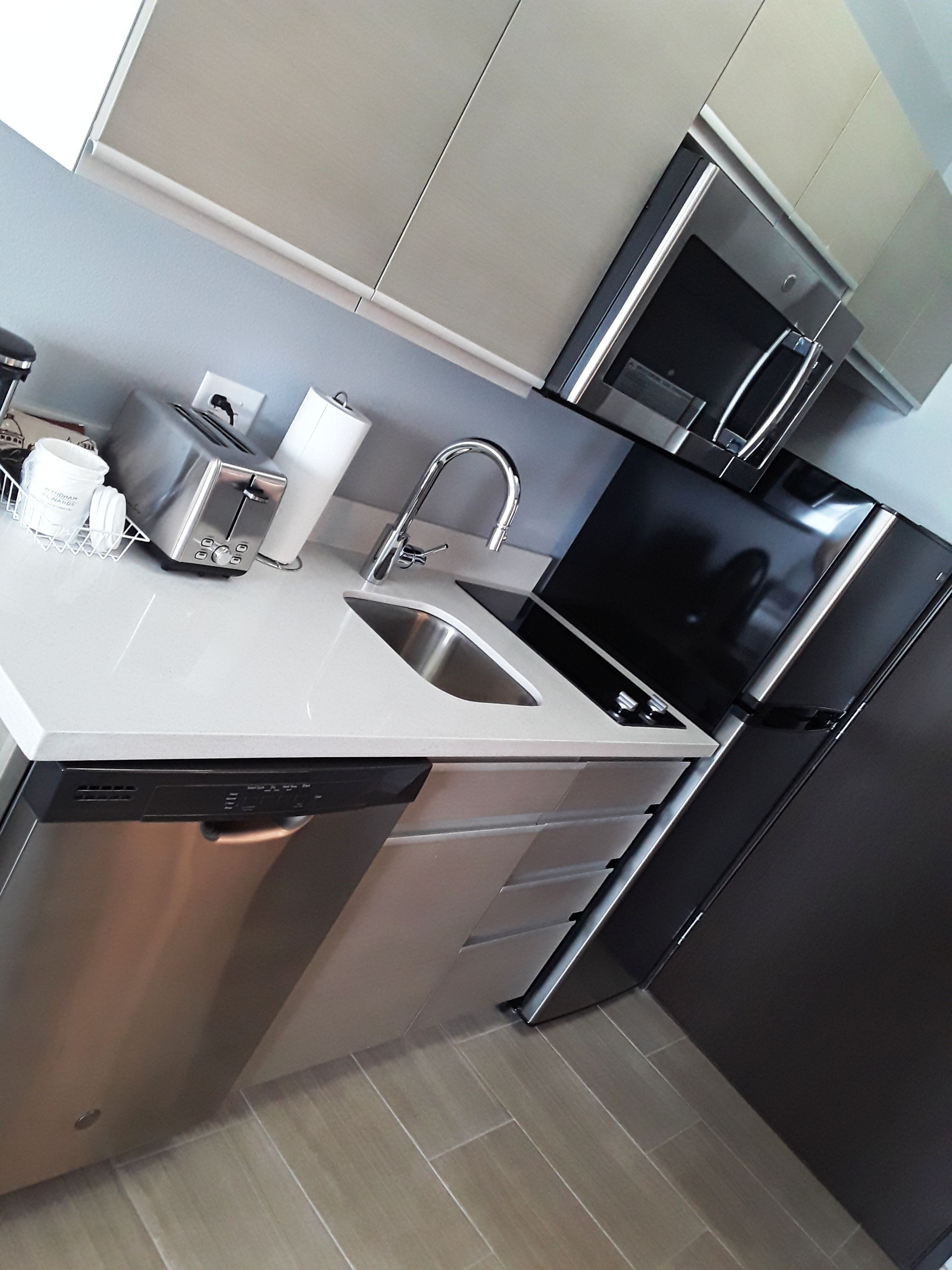 full-sized fridge, microwave, stovetop, dishwasher