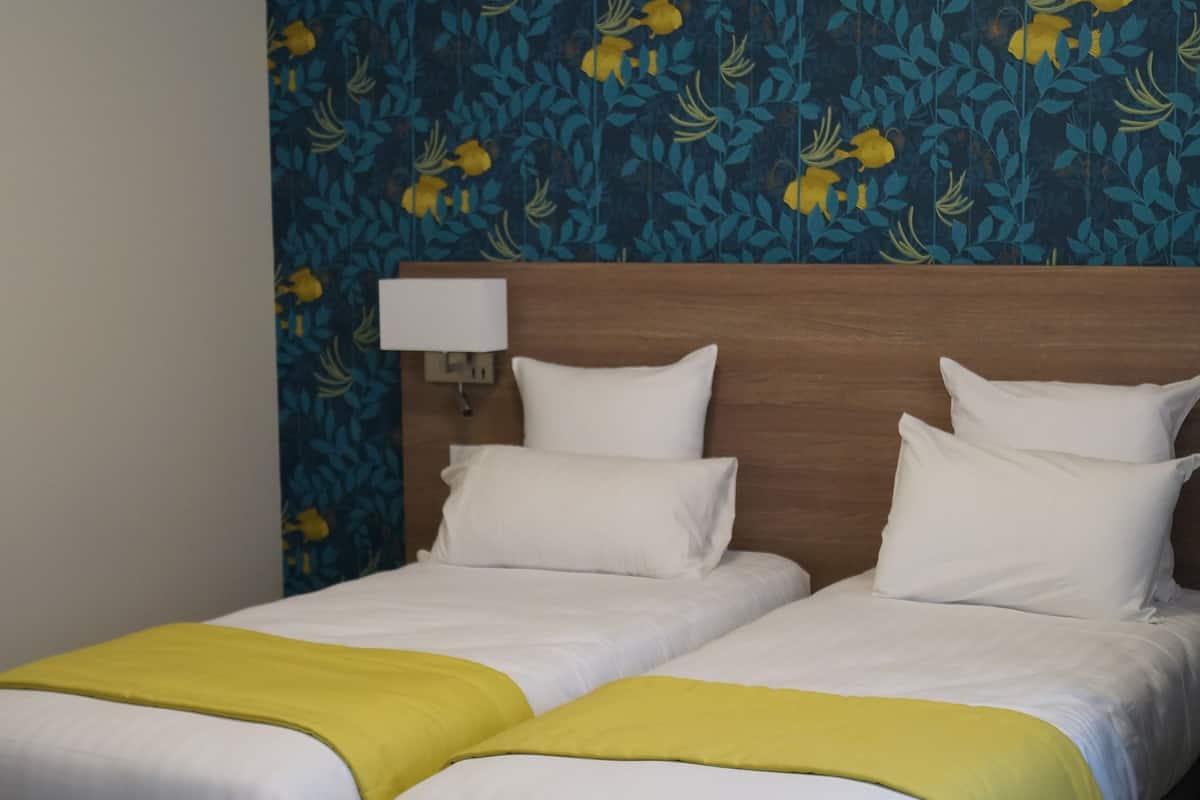 twin room (vue eglise pmr) | premium bedding, in-room safe, desk, laptop workspace