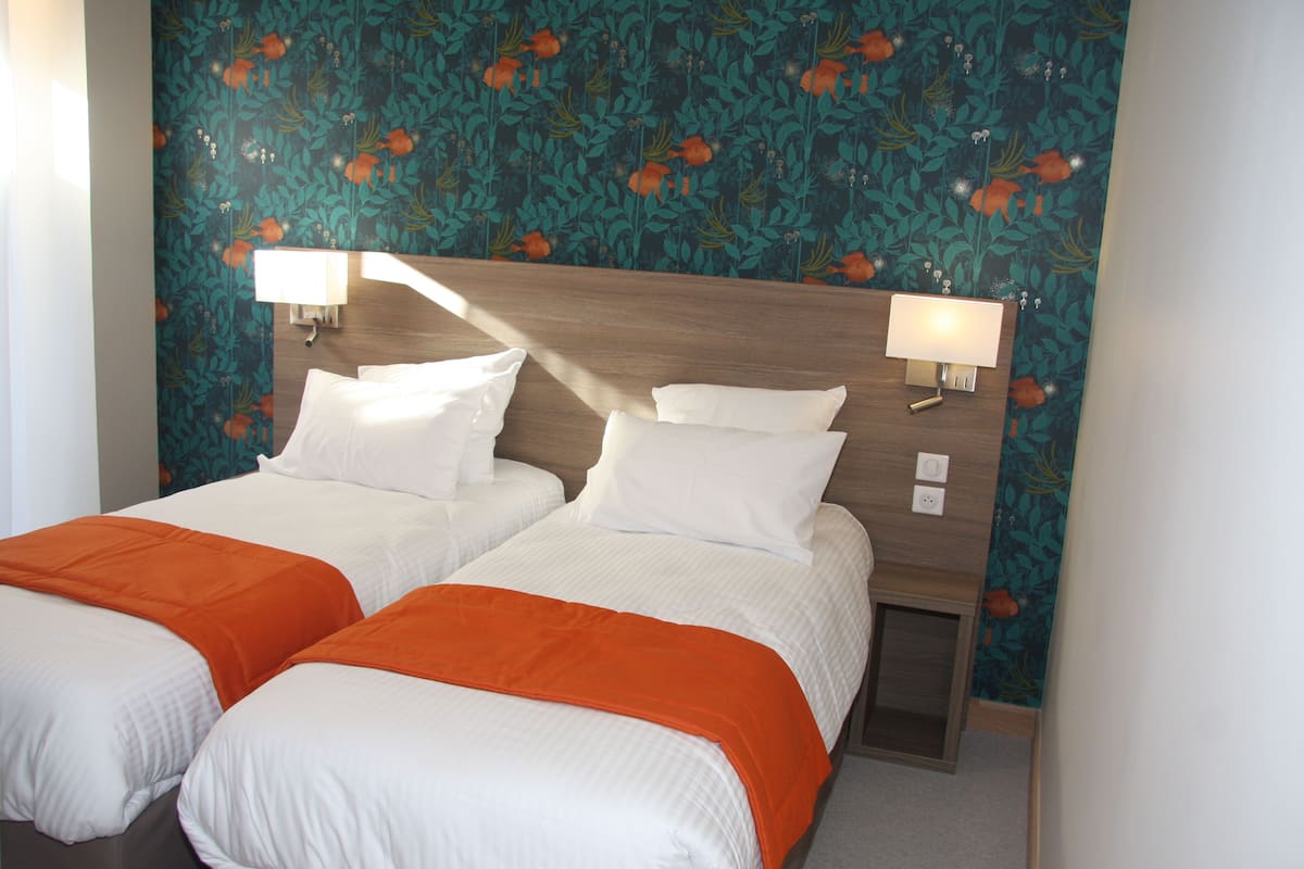 twin room (vue rhone) | premium bedding, in-room safe, desk, laptop workspace