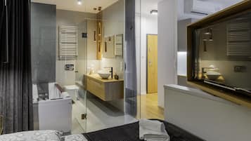 Jetted tub, hydromassage showerhead, designer toiletries, hair dryer