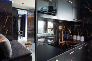 Panoramic Studio Suite, 1 Queen Bed with Sofa bed, City View | Private kitchen | Full-size fridge, microwave, stovetop, dishwasher