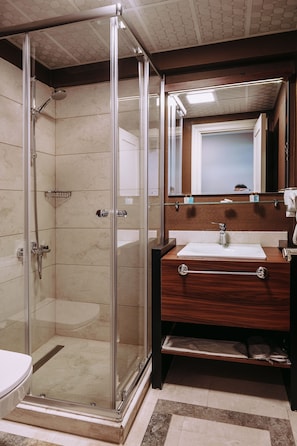 Shower, hair dryer, slippers, towels