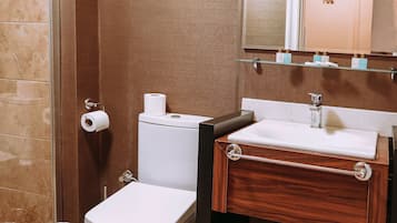 Shower, hair dryer, slippers, towels