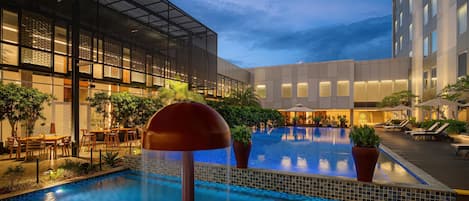 Outdoor pool, open 6:00 AM to 9:00 PM, pool umbrellas, sun loungers