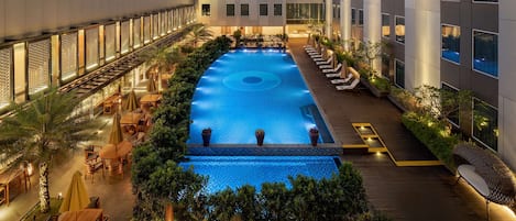 Outdoor pool, open 6:00 AM to 9:00 PM, pool umbrellas, pool loungers